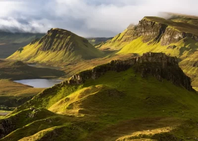 Beautiful morning light with dramatic clouds with a view towards Cleat, taken from The Quiraing on the Isle of Skye, Scotland, UK.