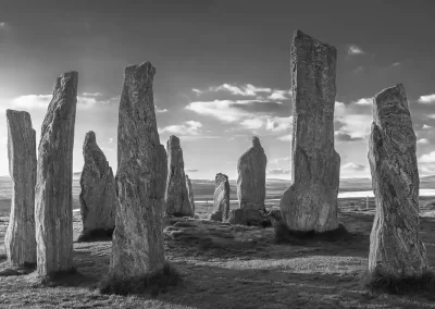 Black-and-white photograph of the prehistoric Callanish Standing Stones on the Isle of Lewis, Scotland.