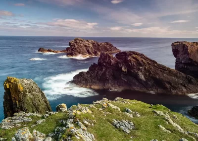 Rugged sea cliffs and Atlantic waves at the Butt of Lewis in the Outer Hebrides, Scotland.