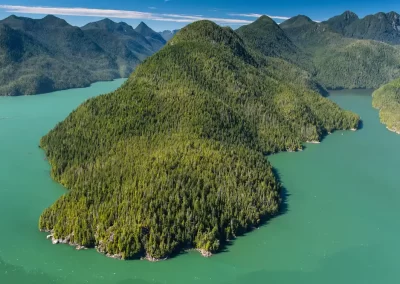 Aerial view of forested islands and turquoise waterways in Clayoquot Sound near Tofino, British Columbia, photographed by Garth Lenz.
