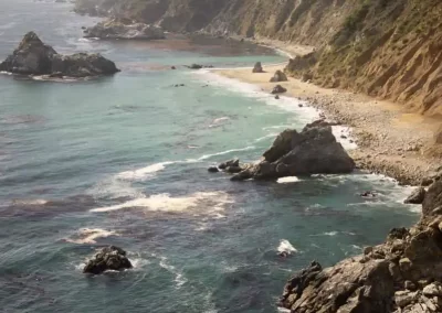 Rocky coves, turquoise water and steep cliffs along the rugged California coastline.