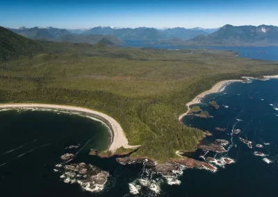 Aerial panorama of sandy bays, rocky coastline, rainforest and mountains near Tofino, British Columbia, photographed by Garth Lenz.
