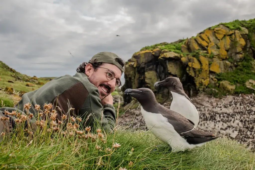 Marc Humphrey, Nature Talks UK photography guide can be seen with two curious razorbills in the foreground on the isle of Lunga. Photo taken by fellow photography guide Louis Guillot.